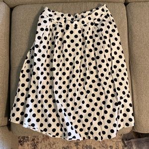 White with black poke-dot skirt. Size L.